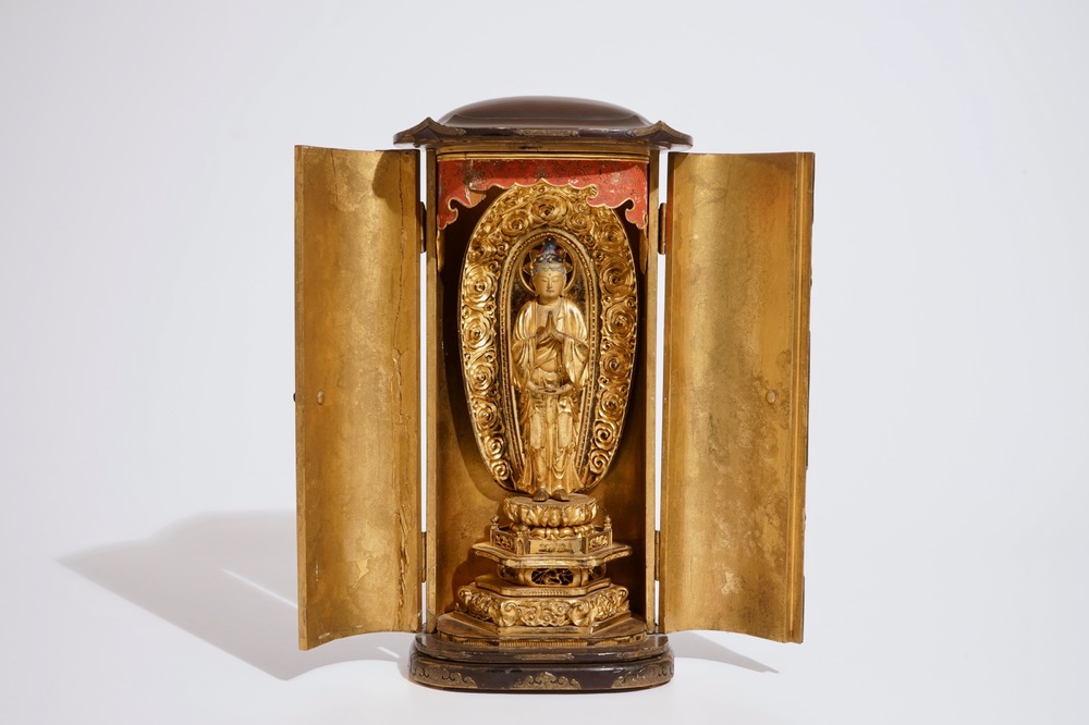 A Japanese lacquered and gilt wood "Zushi" shrine with a standing Buddha on a lotus throne, Edo, 17/18th C.