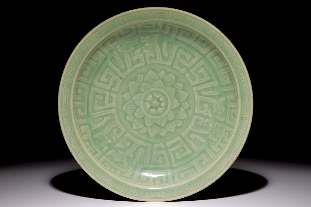 A Chinese celadon dish with incised lotus design, 19th C.