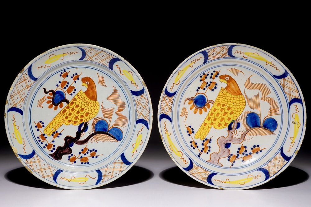 A pair of polychrome Dutch Delft plates with parrots, 18th C.