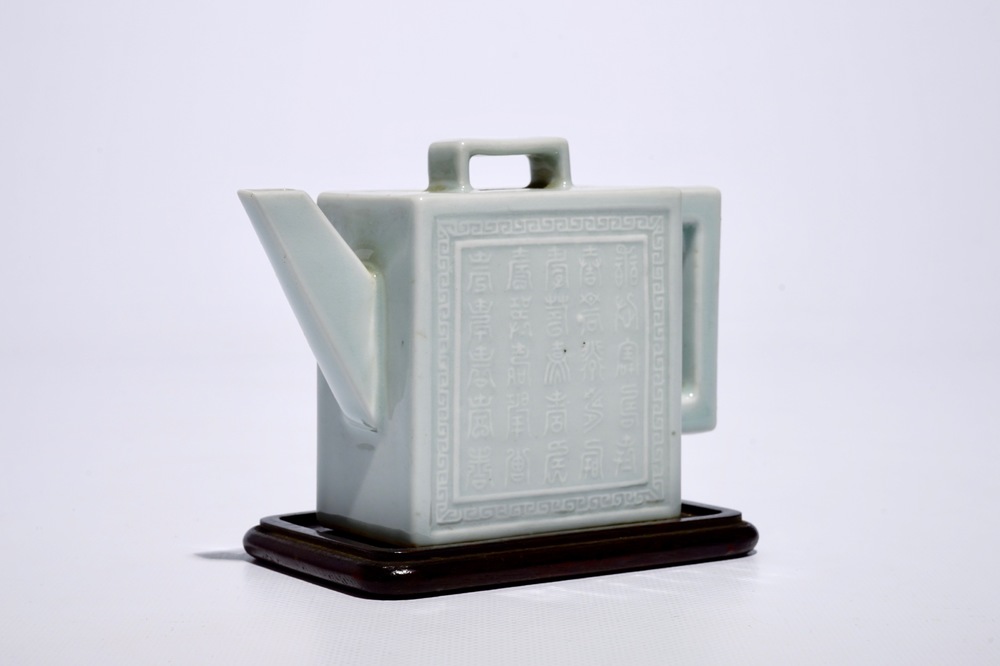 A square Chinese celadon glazed teapot with relief design, Qianlong mark, 19/20th C.