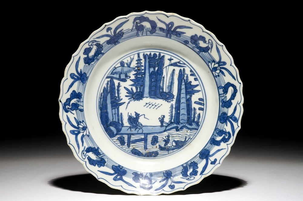 A Chinese blue and white fluted landscape dish, Ming