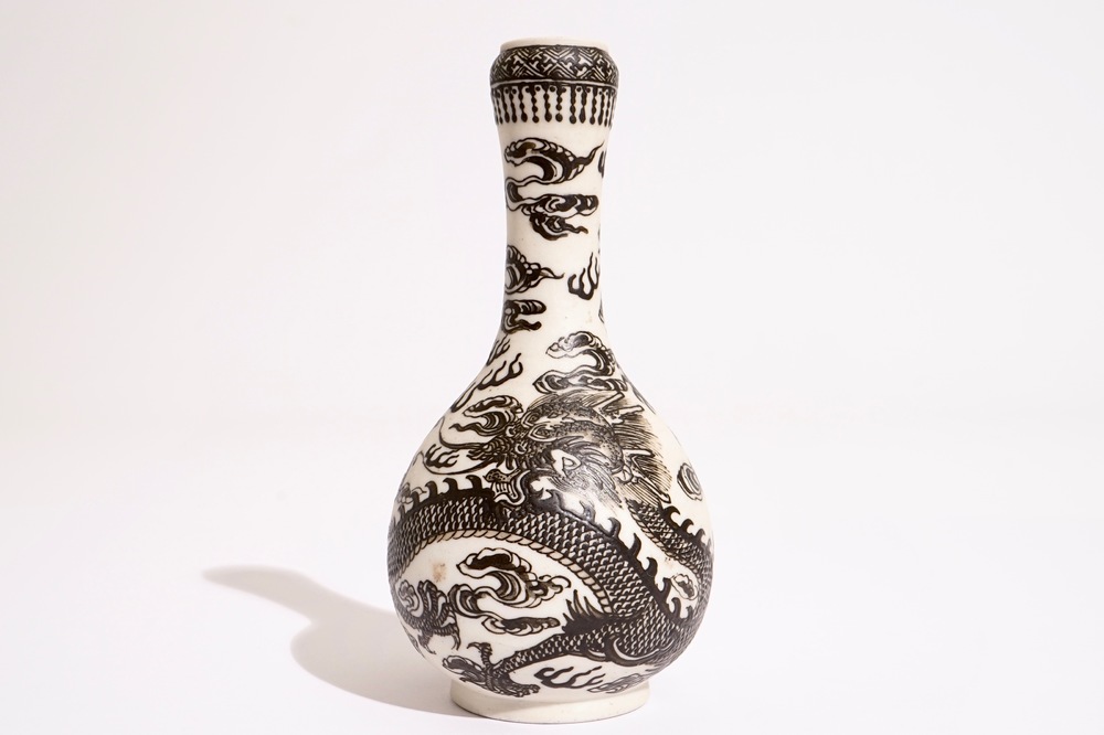 A Chinese black-enamelled biscuit porcelain "dragon" vase, Xuande mark, 18/19th C.