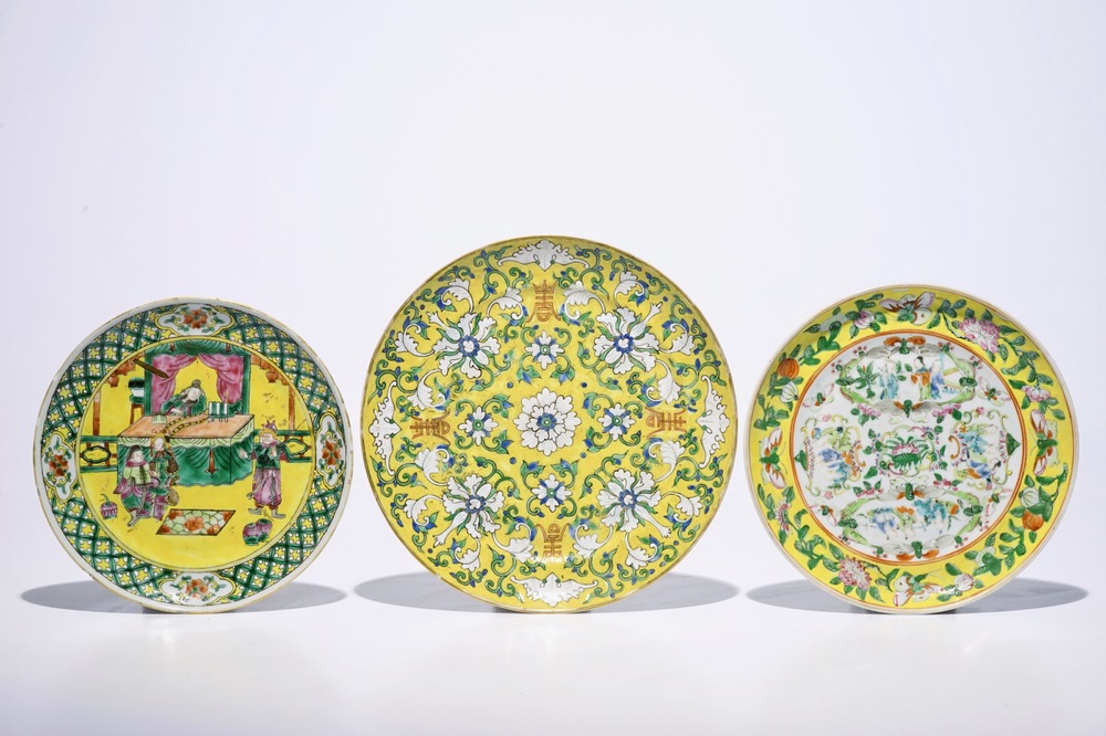 Three Chinese famille rose and verte on yellow ground plates, 19th C.