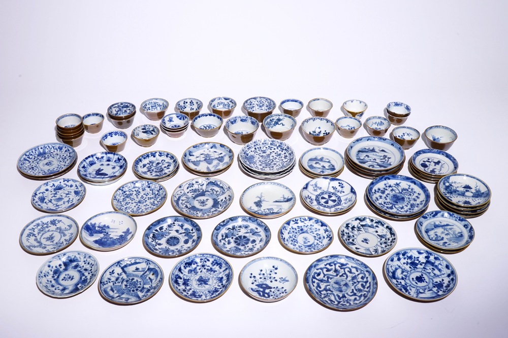 A large collection of Chinese blue and white on capucin brown ground cups and saucers, Kangxi/Qianlong