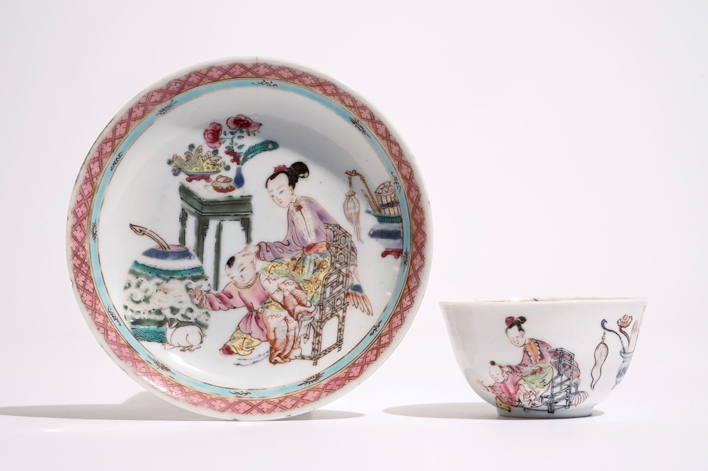 A Chinese famille rose cup and saucer with a lady and a boy, Yongzheng