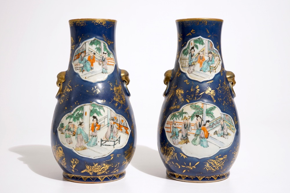 A pair of Chinese famille verte on powder blue and gilt ground vases, 19th C.