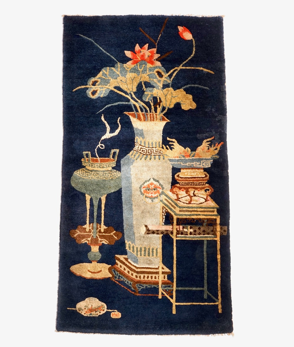 A Chinese Baotou carpet with antiquities design, 19/20th C.