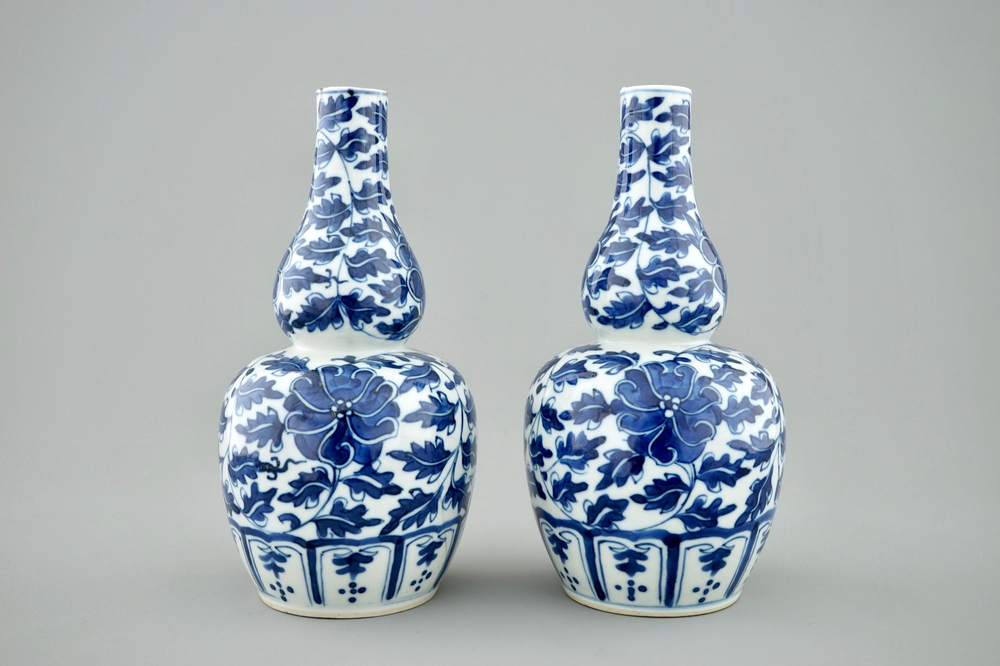 A pair of Chinese blue and white lotus scroll double gourd vases, Xuande mark, 19th C.