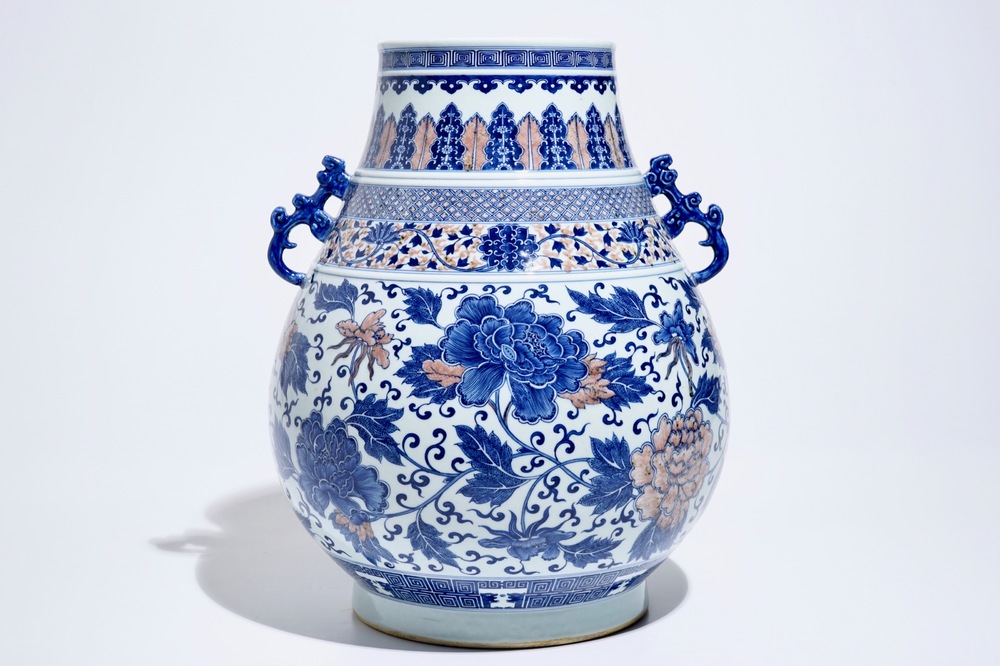 A Chinese copper-red and underglaze blue peony scroll hu vase, Qianlong mark, 19th C.