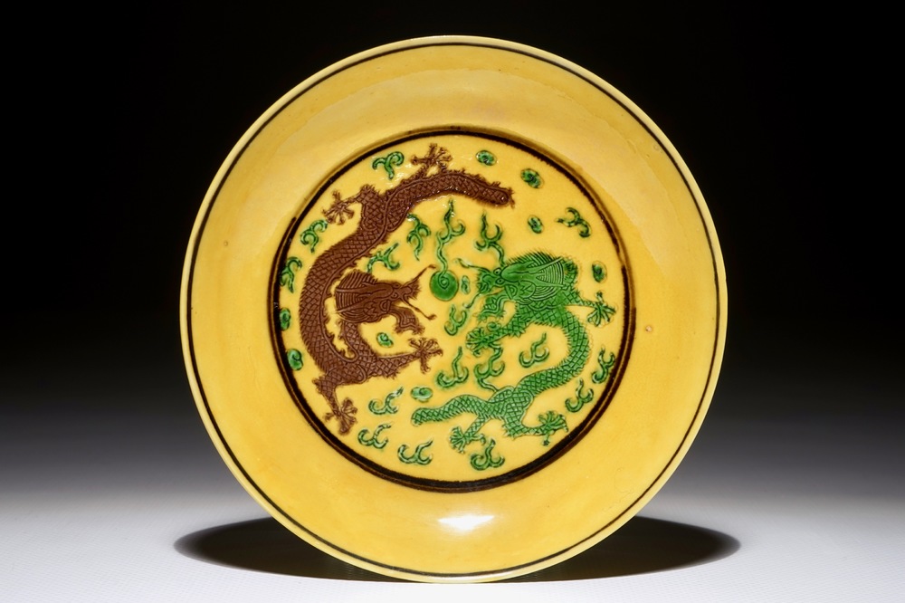 A Chinese yellow-ground dragon saucer dish, Kangxi