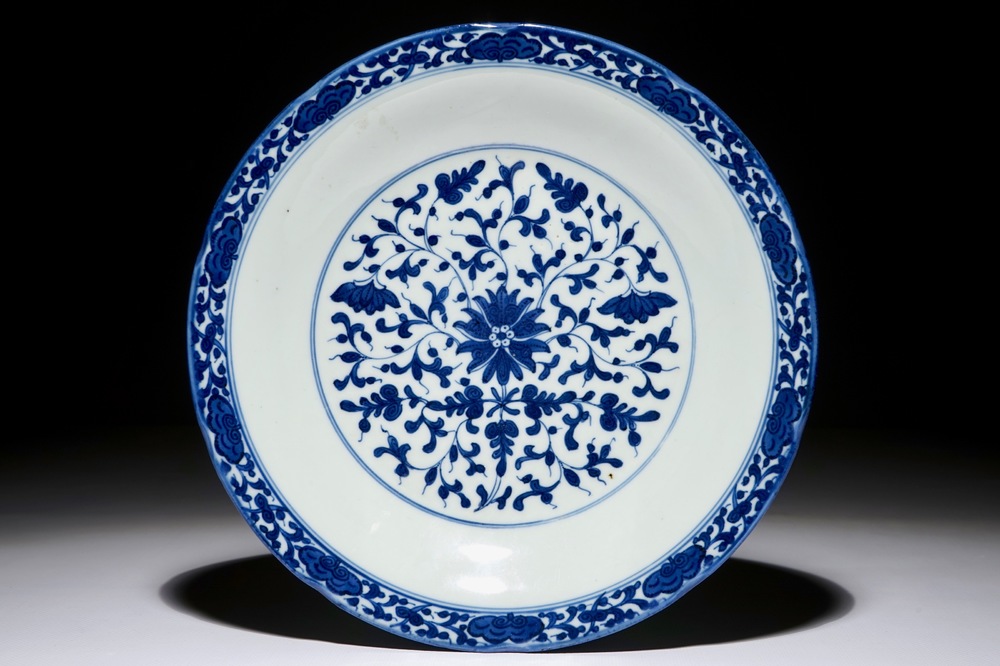 A Chinese blue and white plate with stylized floral design, Qianlong mark and period, minyao