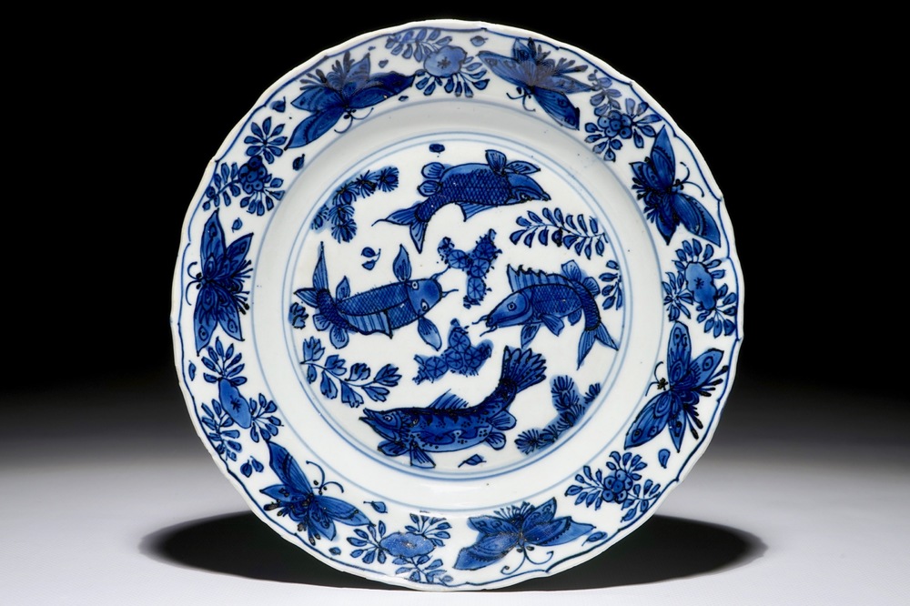 A Chinese blue and white plate with carps and butterflies, Wanli