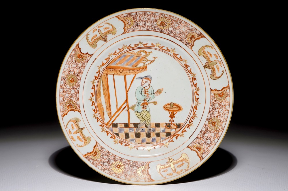 A Chinese famille verte "South Sea Bubble" plate with a Commedia Dell'Arte figure, Kangxi