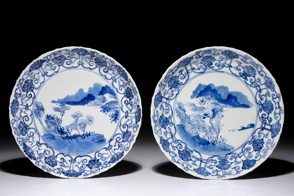 A pair of Chinese blue and white plates with fine landscapes, Kangxi