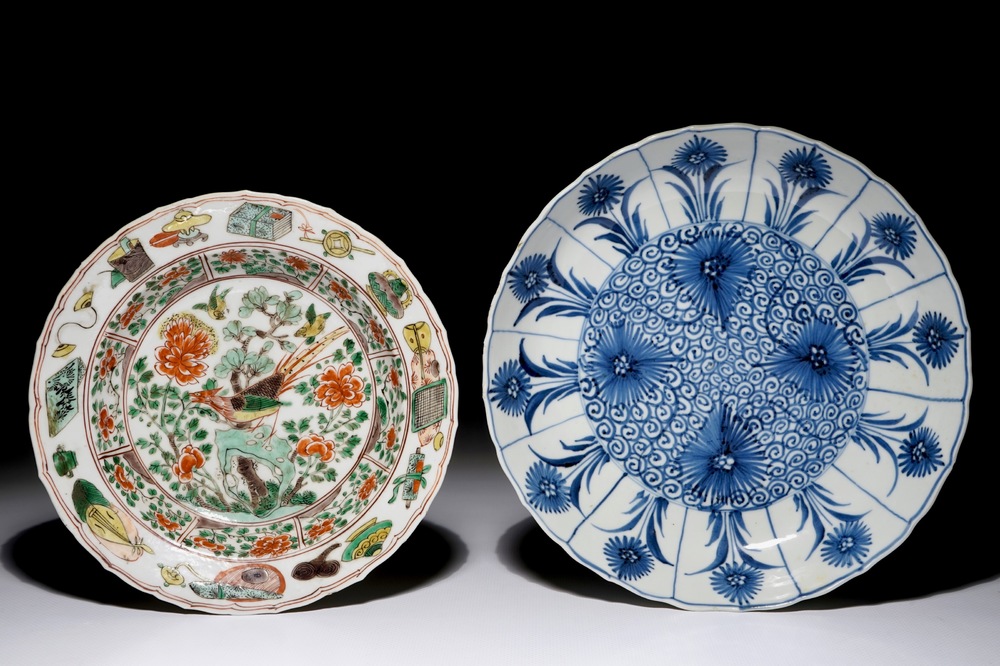 A Chinese famille verte soup plate with a pheasant and a blue and white plate with aster decoration, Kangxi
