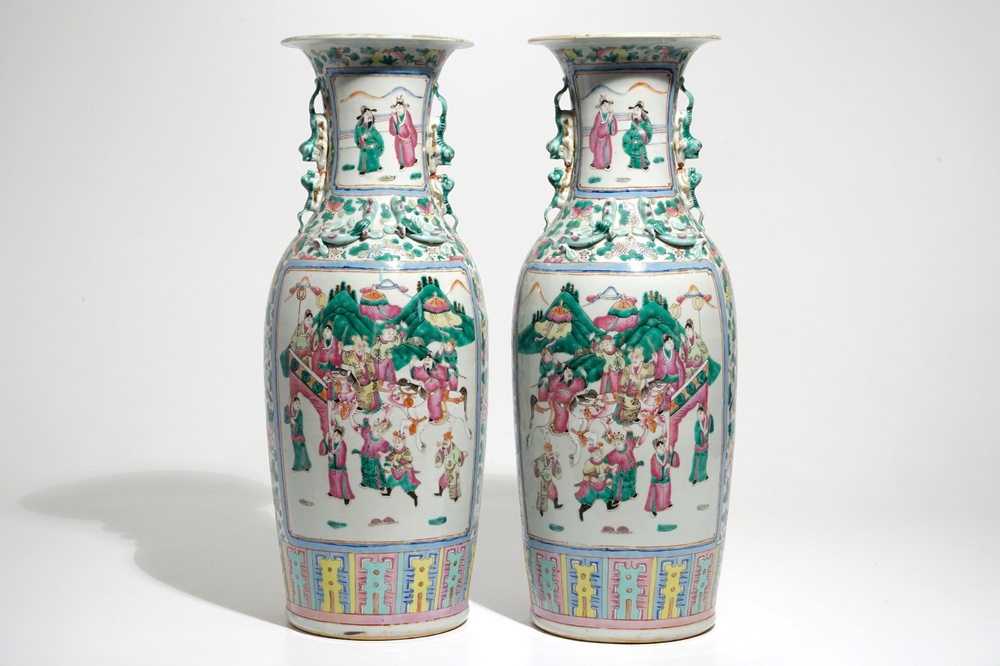 A pair of tall Chinese famille rose vases with court scenes, 19th C.