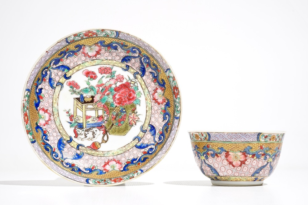 A Chinese famille rose cup and saucer with a cat, Yongzheng