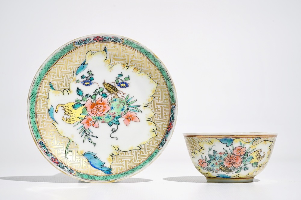 A Chinese famille rose cup and saucer with an insect on sanduo fruit, Yongzheng