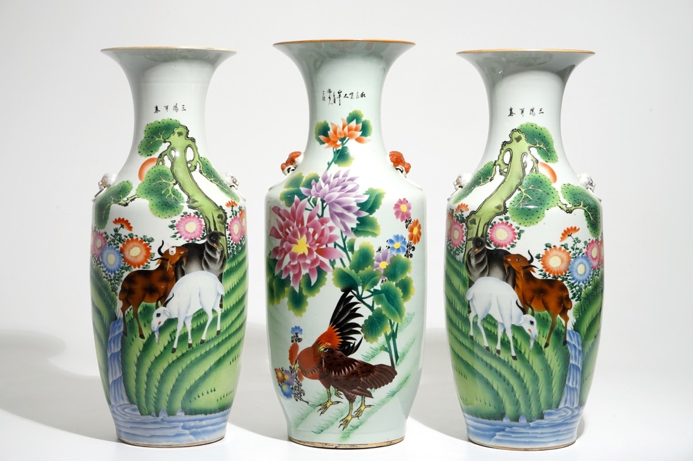 A pair of Chinese famille rose vases with goats and one with roosters, 20th C.