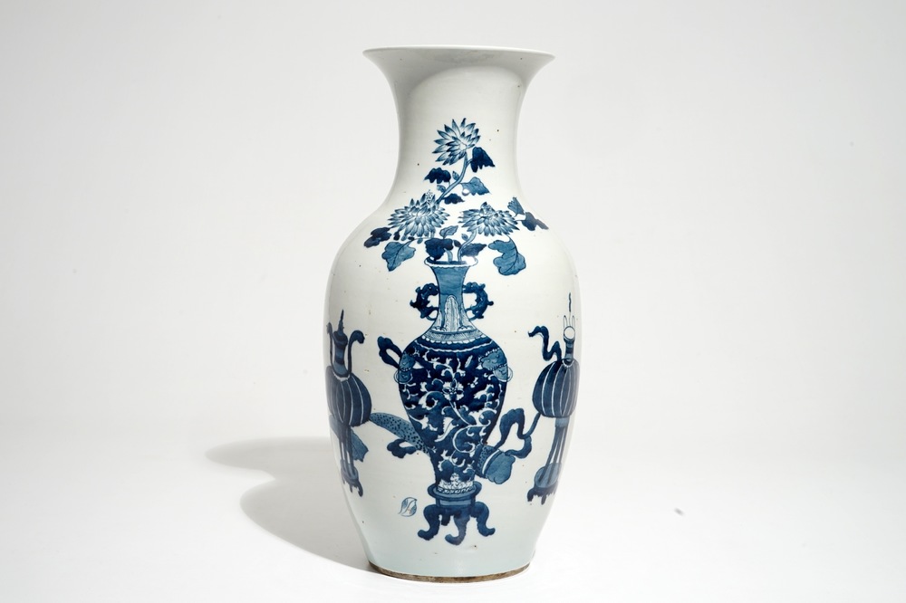 A Chinese blue and white vase with incense burners and furniture, 19/20th C.
