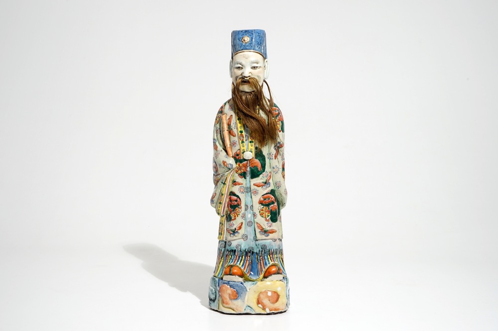 A tall Chinese famille rose figure of an immortal, 19th C.