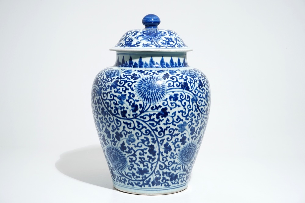 A tall Chinese blue and white baluster jar and cover with lotus scrolls, Kangxi