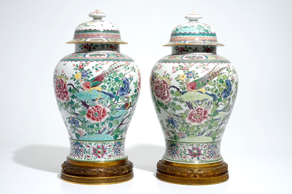 A pair of tall bronze-mounted famille rose baluster vases and covers, Samson, Paris, 19th C.