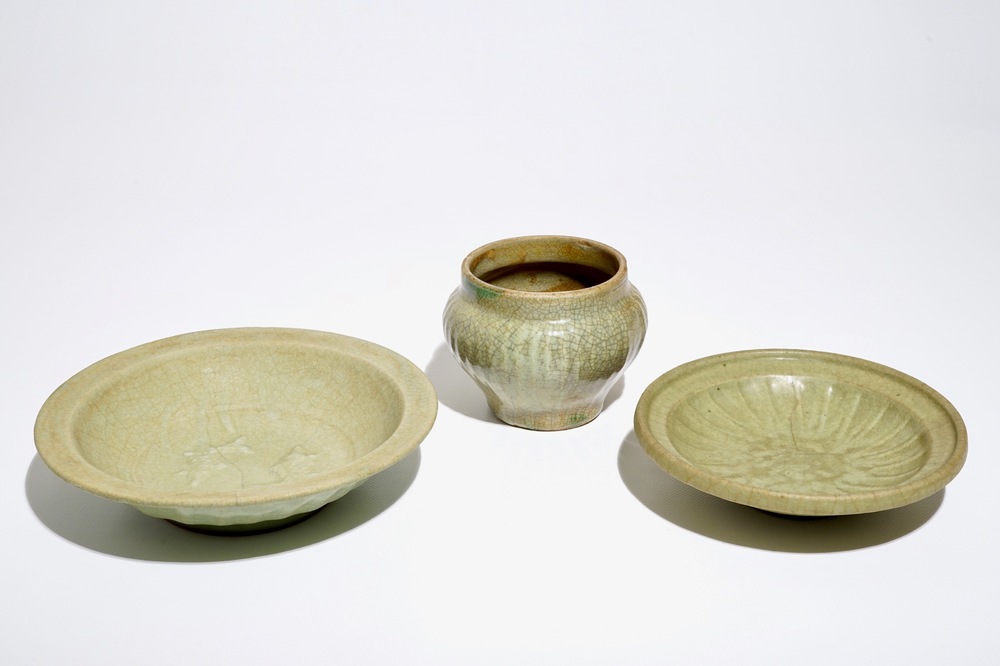 A Chinese Longquan celadon-ground crackle-glazed jar and two dishes, Ming