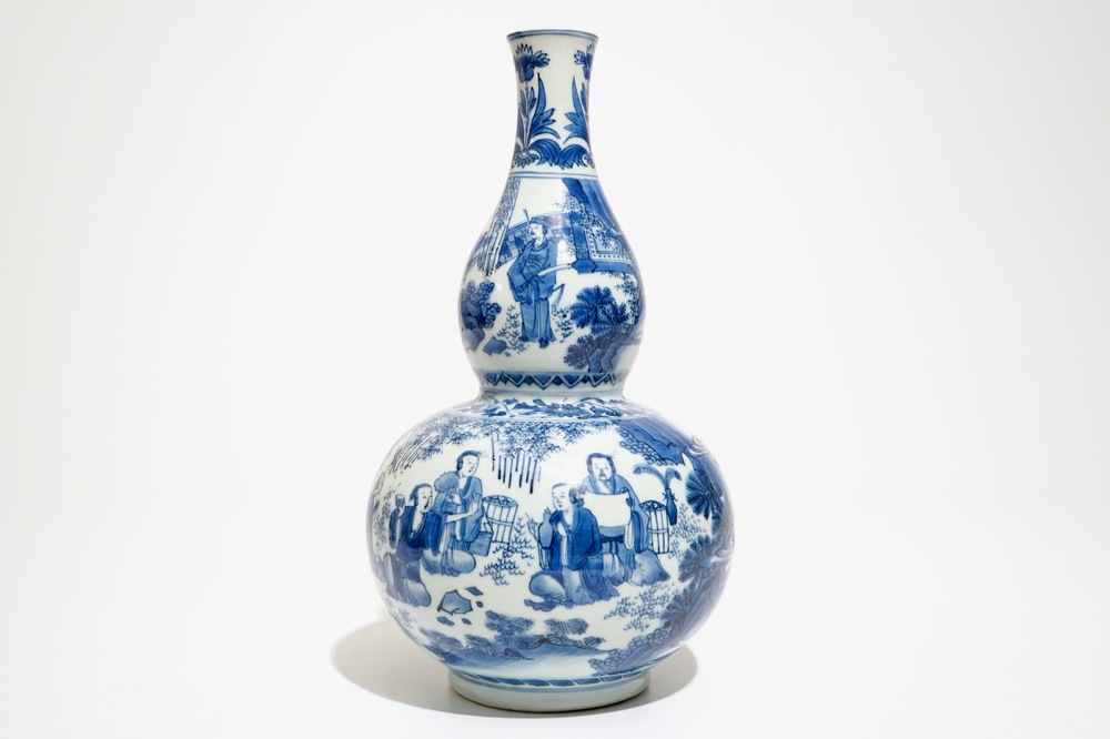 A Chinese blue and white double gourd vase with scholars, Transitional period, Chongzhen