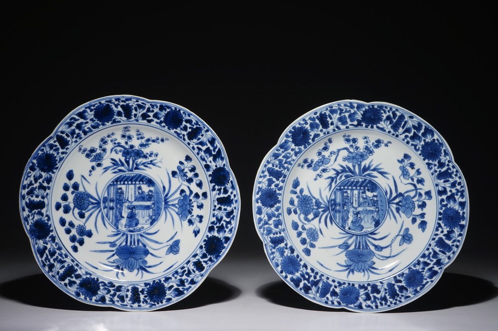 A pair of Chinese blue and white plates with figural medallions, Kangxi