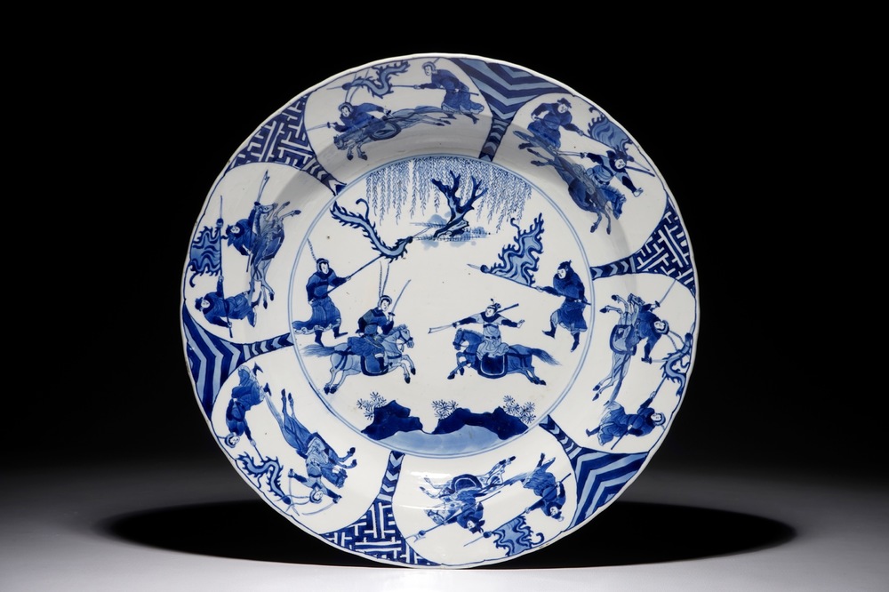 A Chinese blue and white charger with fighting warriors on horseback, Chenghua mark, Kangxi