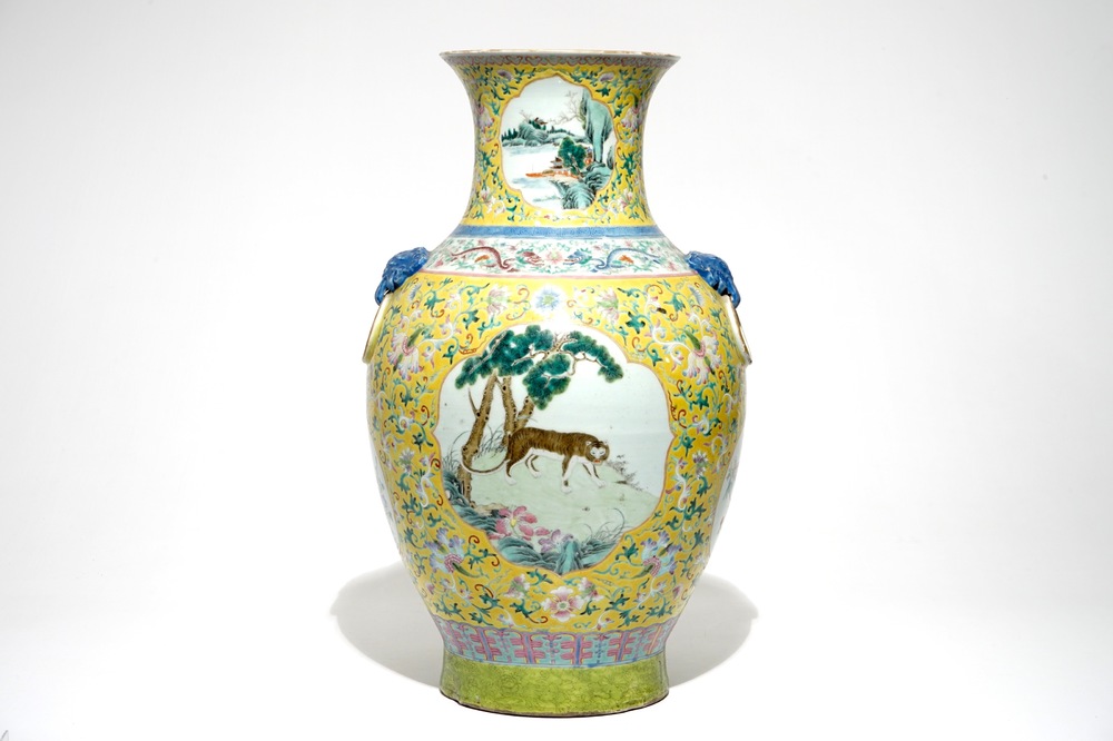 A tall Chinese famille rose yellow-ground vase with a tiger, Qianlong mark, 19th C.