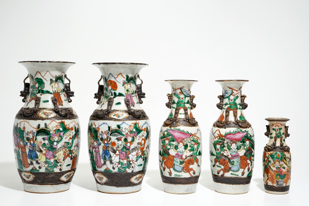 Two pairs of Chinese Nanking famille rose vases and a smaller one, 19/20th C.