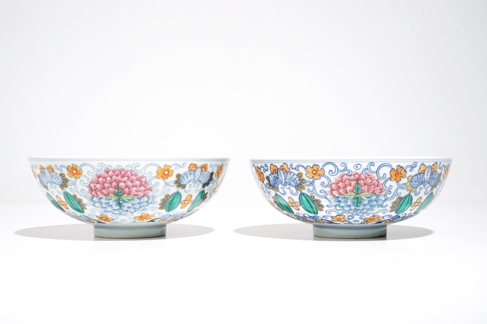 A pair of Chinese doucai bowls with floral famille rose medallions, 4-character mark, 19/20th C.