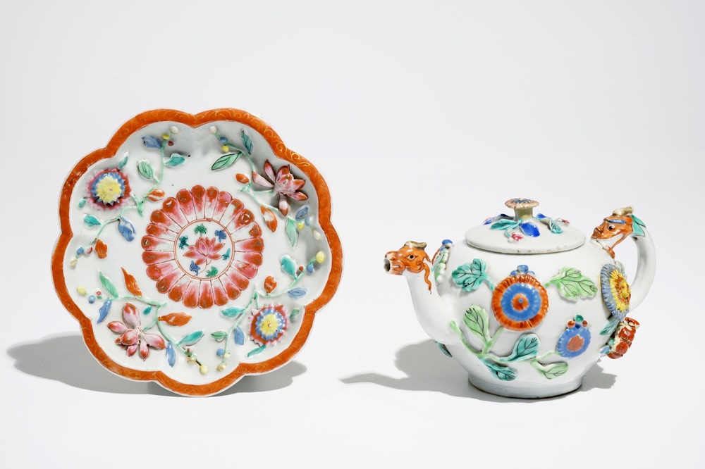 A Chinese famille rose teapot on stand with applied decoration, Yonzheng