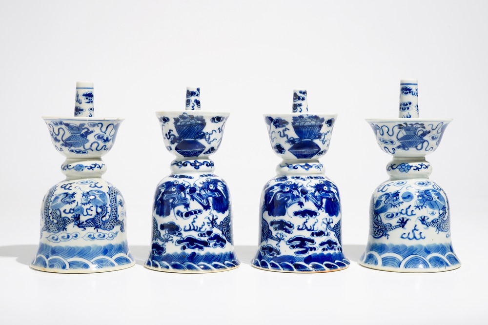 Two pairs of Chinese blue and white candlesticks with dragons, 19/20th C.