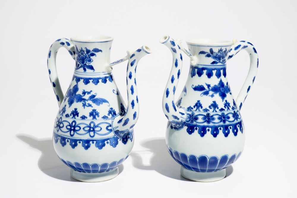 A pair of Chinese blue and white ewers, Transitional period