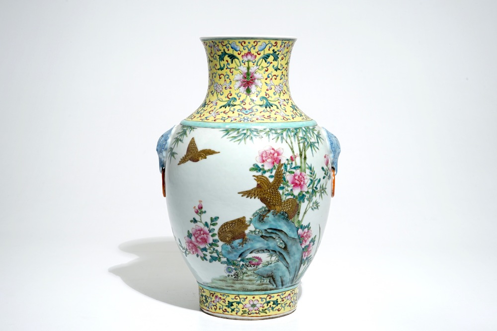 A Chinese famille rose hu vase with birds among flowers on rockwork, Qianlong mark, 19/20th C.