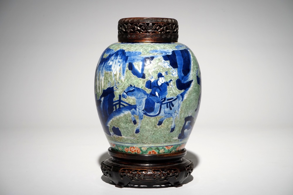A Chinese famille verte jar with wooden cover and stand, Kangxi