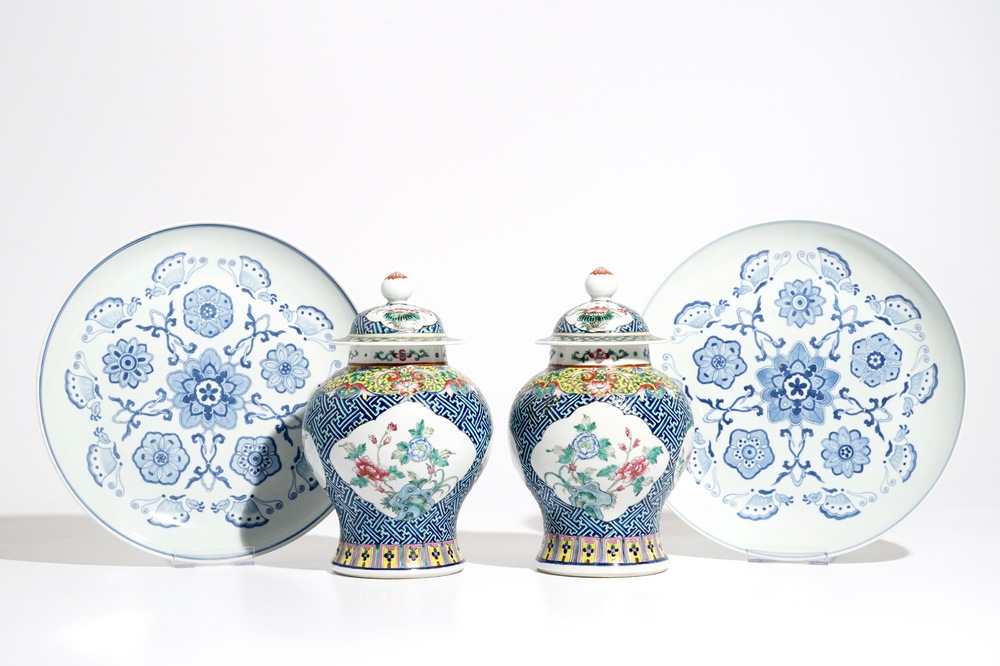 A pair of Chinese famille rose vases and covers, 19th C., and a pair of blue and white dishes, 20th C.