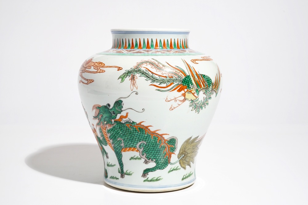 A Chinese wucai baluster vase with a kylin and a phoenix, 19th C.