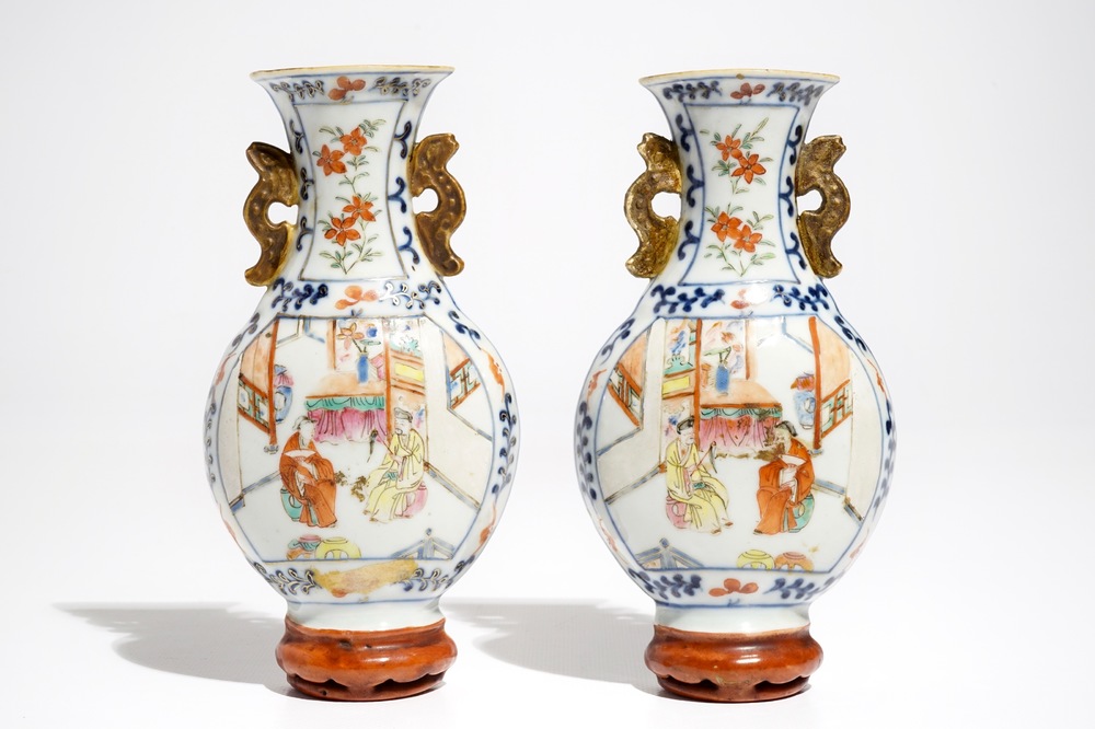 A pair of Chinese famille rose wall vases with figural design, 19th C.
