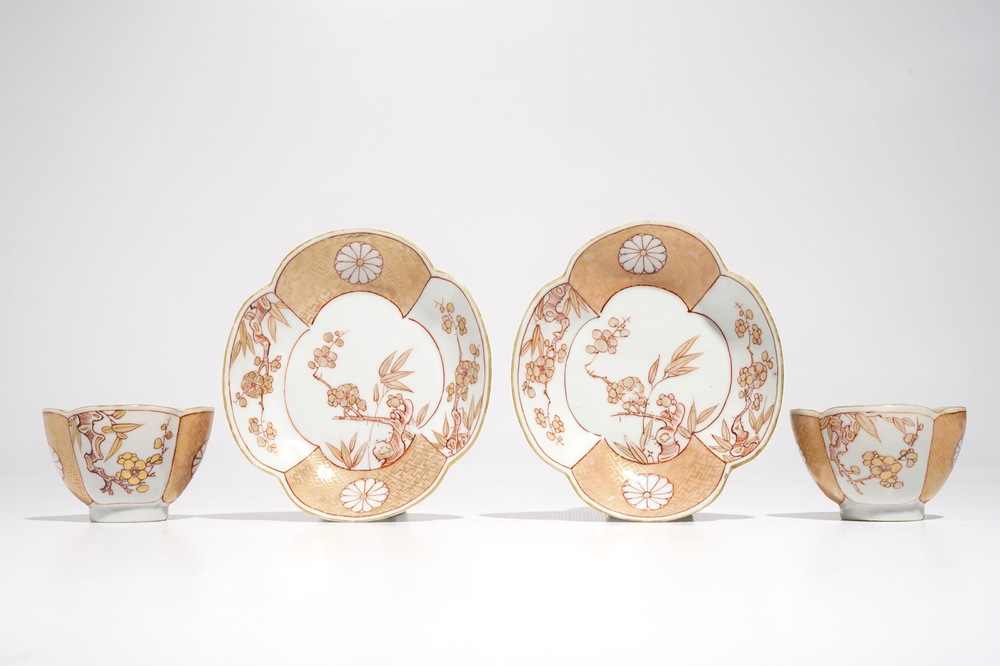 A pair of Chinese milk and blood quatrefoil cups and saucers, Kangxi