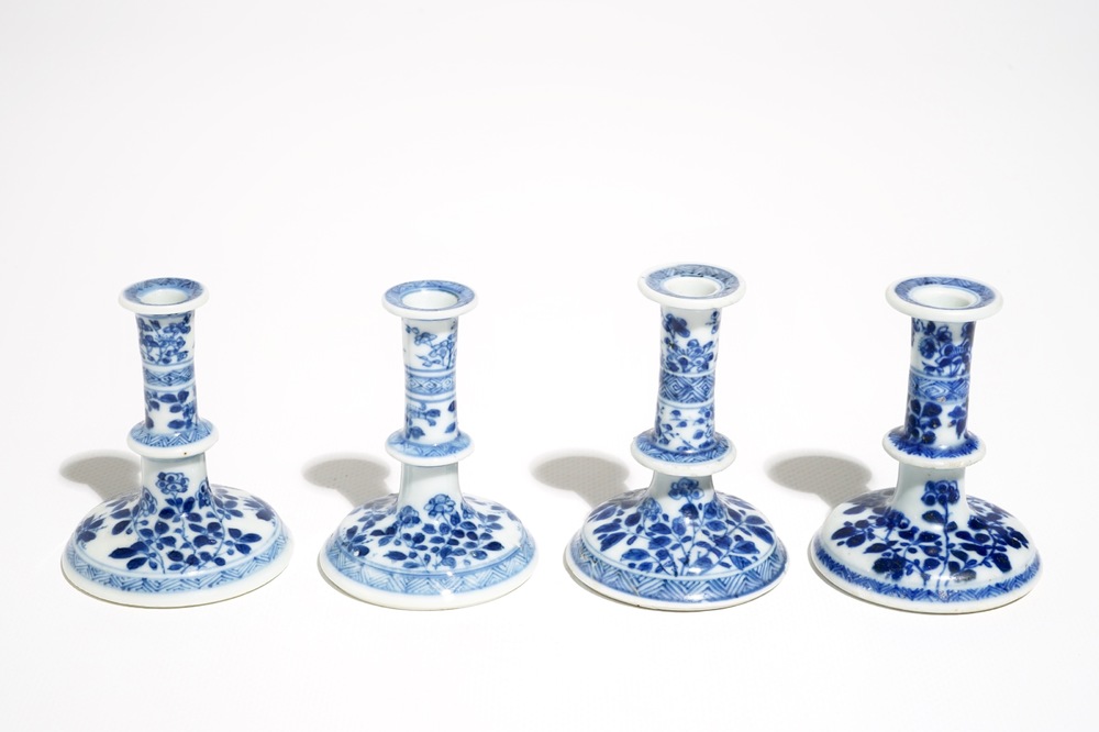 Four small Chinese blue and white floral candlesticks, Kangxi