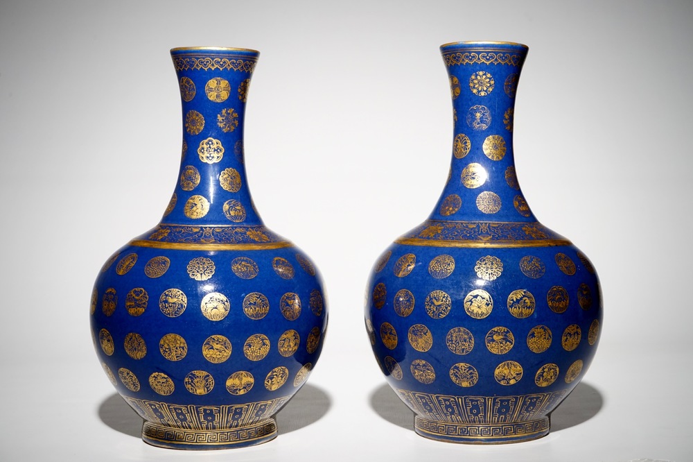A pair of Chinese gilt-decorated powder blue-ground bottle vases, Qianlong mark, Guangxu