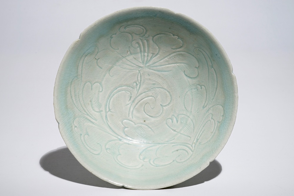 A Chinese incised qingbai foliate bowl with underglaze floral design, Song