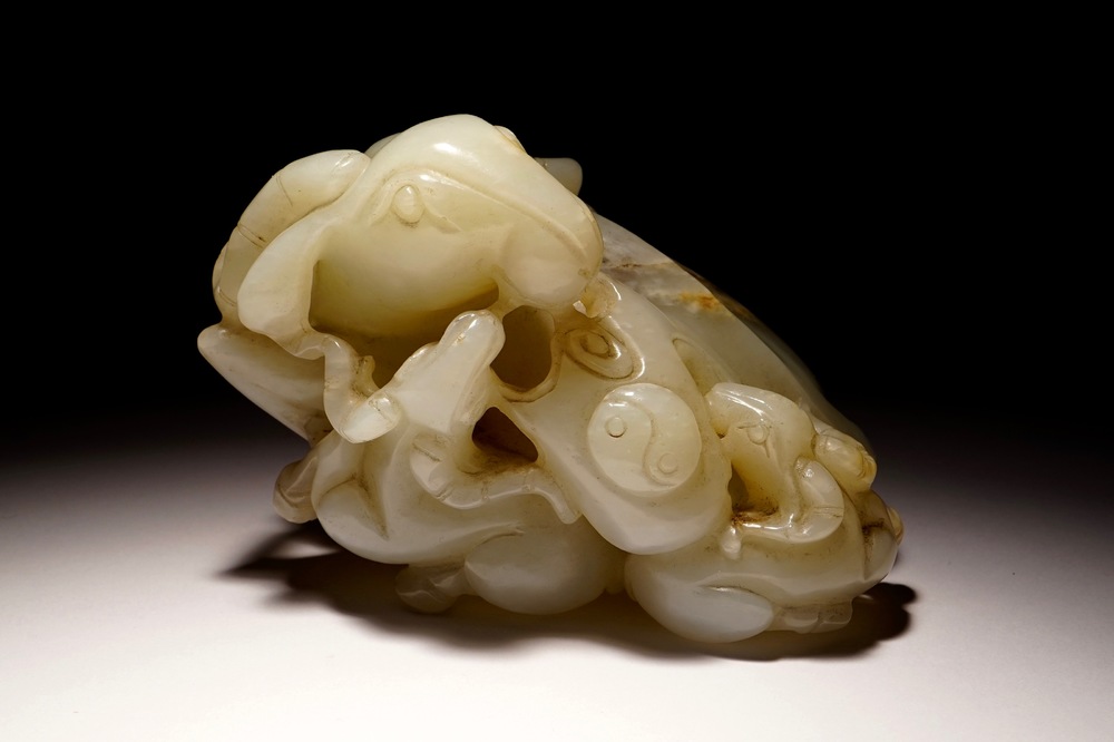 A Chinese white jade carving of a "Three rams" group, 19/20th C.