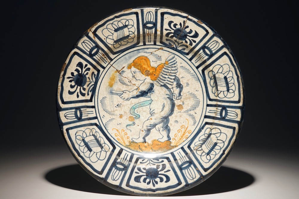 A rare Dutch Delft or Haarlem maiolica dish with a putto, 1st half 17th C.