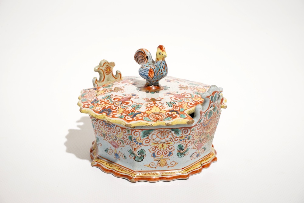 A polychrome Dutch Delft petit feu butter tub with a rooster-topped cover, 18th C.