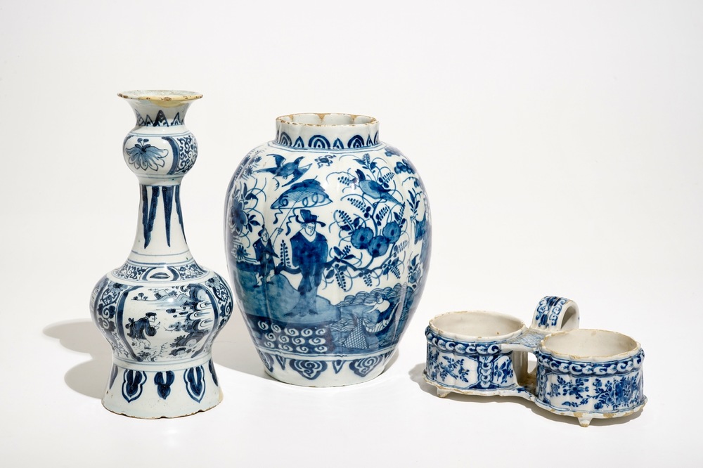 Two Dutch Delft blue and white chinoiserie vases and a cruet stand, 17/18th C.